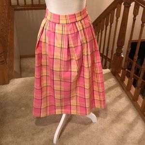 Darling cotton plaid skirt with elastic waist.